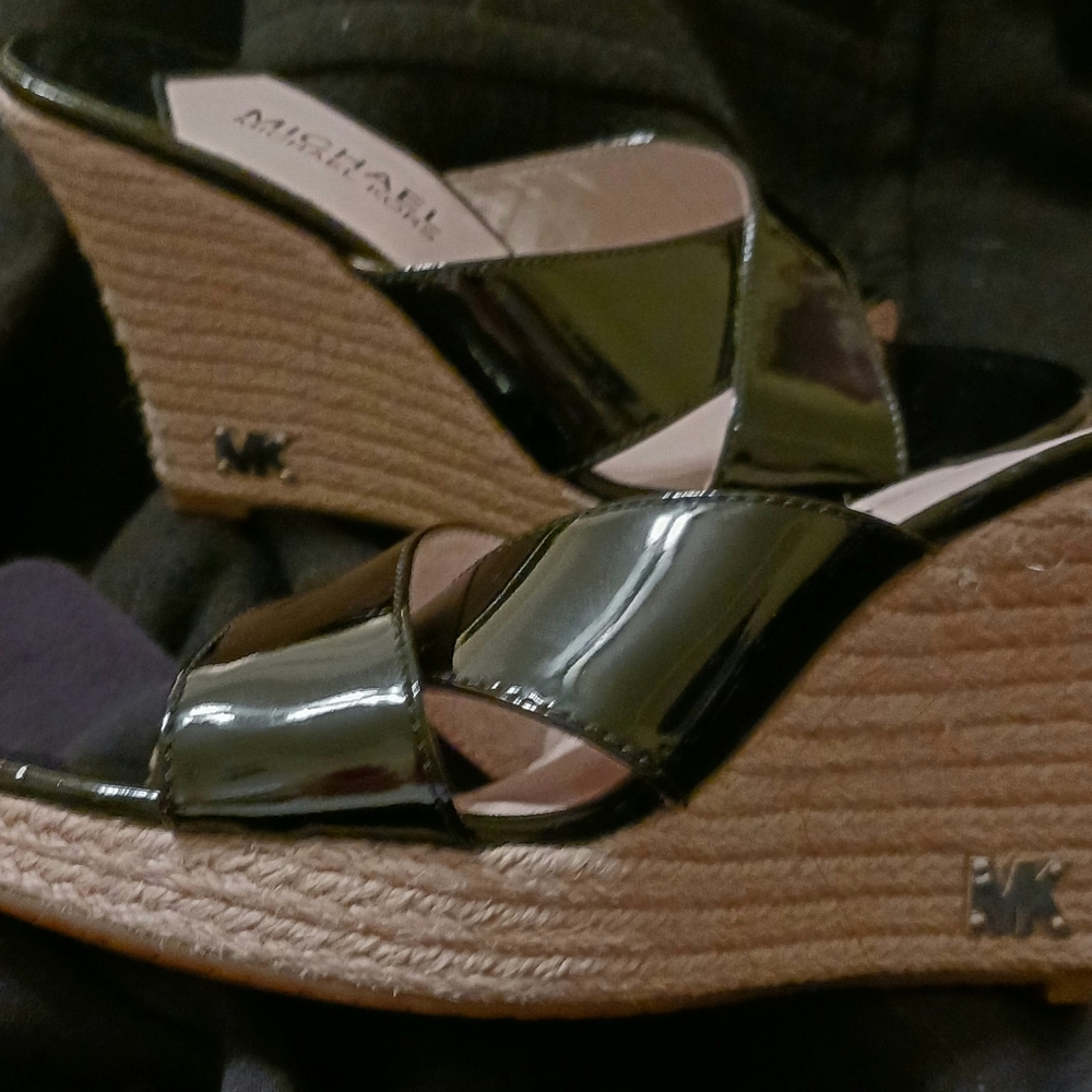 Sorely boots , tan in color and made of leather and suede